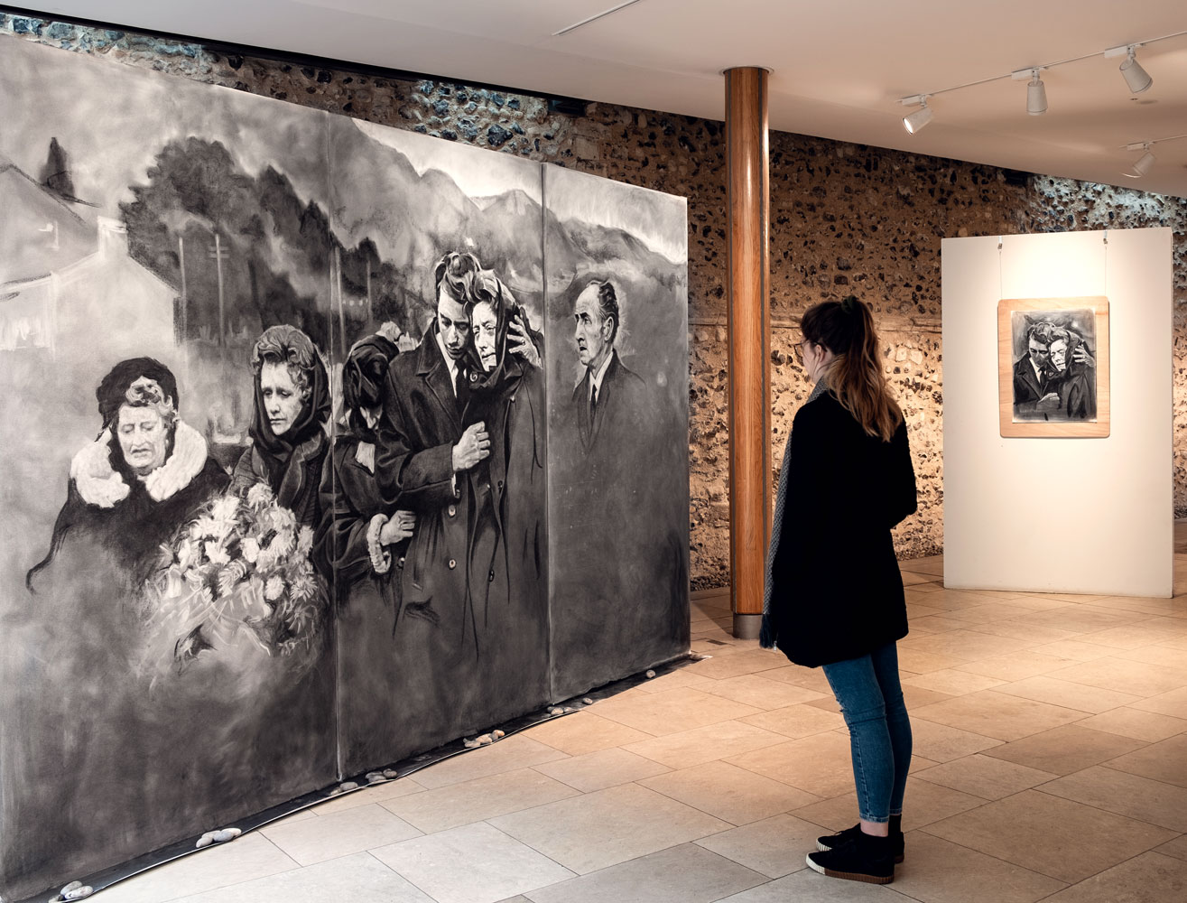 A visitor looks at the large drawing made by artist James Kessell at Norwich Cathedral